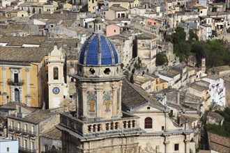 City of Ragusa, the tower of the church of Santa Maria dell Itria and houses in the district of