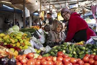 Old woman on a stall selling vegetables at the Osh Bazaar, Bishkek, Kyrgyzstan, Asia