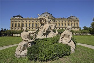 Ornamental fountain with sculptures in the palace park of the baroque UNESCO Residence Palace,