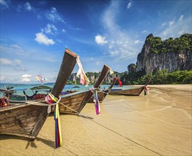 Long tail boats on tropical beach Railay beach in Thailand