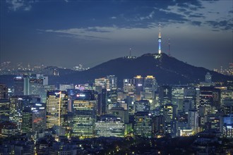 Seoul downtown cityscape illuminated with lights and Namsan Seoul Tower in the evening view from