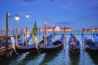 Romantic vacation Venice travel background, gondolas at Saint Mark (San Marco) square and Basilica