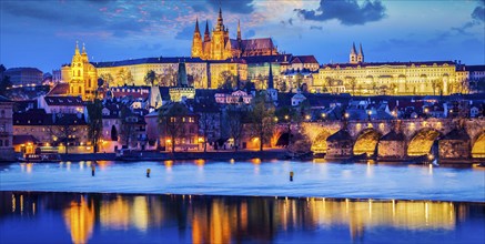 Panorama of Prague Castle and St. Vitus cathedral in twilight with dramatic sky. Prague, Czech