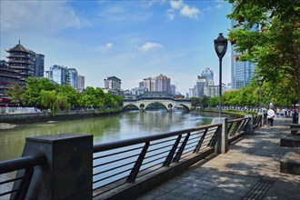 CHENGDU, CHINA, APRIL 15, 2018: Embankment quay of Jin river and Anshun bridge in Chengdu, Sichuan,