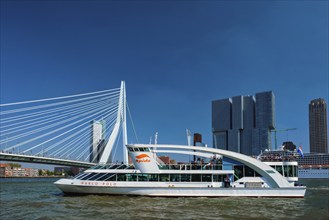 ROTTERDAM, NETHERLANDS, MAY 10, 2017: Rotterdam cityscape with Erasmus bridge and ship on Nieuwe