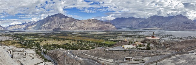 Panorama of Nubra valley in Himalayas with giant Buddha statue in Diskit, Ladakh, India, Asia