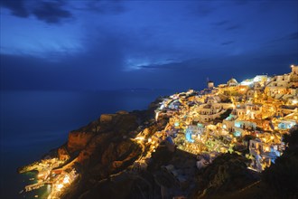 Famous greek iconic picturesque tourist destination Oia village with traditional white houses and