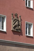 House sign, relief, eagle feeding its young in the nest, Bergstr. 13 ud 15, Nuremberg, Middle