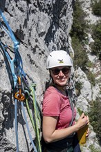 Climber on the rope, multi-pitch climbing, Via la Bellezza della Venere climbing tour, Garda