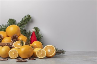 Basket with oranges and lemons, vitamin C, Christmassy, light background, copy room