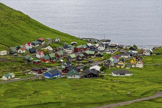 Little village Funnigur in a huge fjord, Estuyroy, Faroe islands, Denmark, Europe