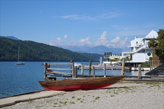 Boat, shore, wooden jetty, summer, Lake Millstatt, Millstatt, Carinthia, Austria, Europe