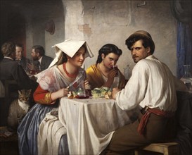 In front of a Roman osteria, man sitting with two woman at a table eating, the woman flirting with