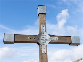 Christian cross with inscription, One bears the other's burden, Hochwald summit, Zittau Mountains,