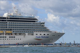 View from the Riva del Mandracchio, promenade, to the harbour with the cruise ship Costa Deliziosa,