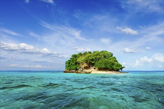 Vacation holidays concept background, tropical island and long-tail boat in sea. Thailand