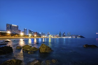 Haeundae beach in Busan at night with illuminated skyscrapers, Busan, South Korea, Asia