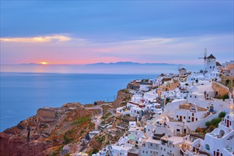 Famous greek iconic selfie spot tourist destination Oia village with traditional white houses and