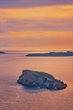 Aegean Sea with Greek islands view on sunset. Cape Sounion, Greece, Europe