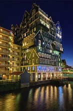 ZAANDAM, NETHERLANDS, MAY 8, 2017: Inntel Hotel in Zaandam illuminated at night. Design of