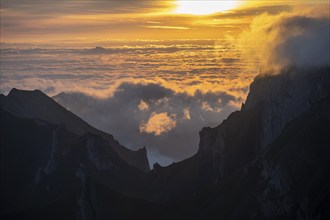 Sunrise, sun shining over mountains in fog, Säntis, Appenzell Ausserrhoden, Appenzell Alps,