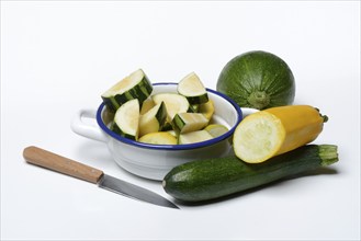 Various courgettes (Cucurbita pepo), courgettes cut up in pot convar. giromontiina