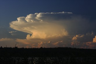 Cloud formation with reflection in the water over a lake in Mecklenburg, Müritz National Park,