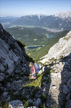 Climber on the ascent to the Westliche Wettersteinspitze, Wetterstein Mountains, Bavaria, Germany,