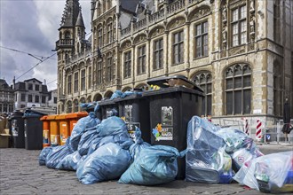 Rubbish bags and garbage containers with piled up household refuse due to strike by the waste