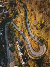 Aerial view S-curve in autumn, Calw, Black Forest Germany