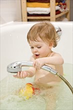 Symbolic image of a toddler bathing