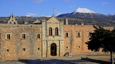 Main entrance, national flag, forecourt, tree, Ida massif, Psiloritis, snow-capped mountain,