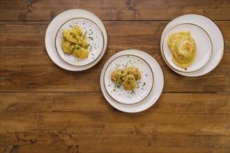 Top view of table with three dishes for rustic dinner