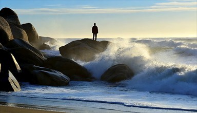 A lone man stands on a rock in the surf, with AI generated