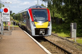 Abellio Greater Anglia class 745 train arriving at platform of railway station, Melton, Suffolk,