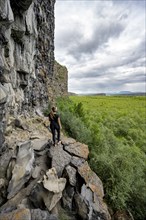 Tourist standing at the canyon, Asbyrgi Canyon, Lake Botnstjörn, lake at a cliff, Icelandic