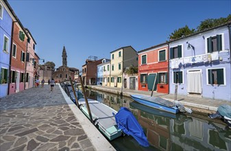 Colourful houses on the canal with reflection, canal with boats and colourful house facades, in the