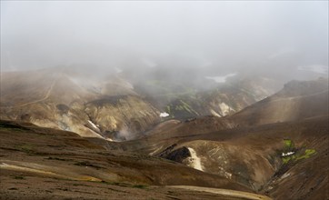 Cloudy colourful rhyolite mountains, geothermal area Hveradalir, Kerlingarfjöll, Icelandic