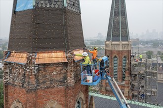 Detroit, Michigan, Workers repair the towers of the Basilica of Ste. Anne de Detroit. Ste. Anne was