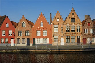 Typical Belgian cityscape Europe tourism concept, canal and old houses on sunset. Bruges (Brugge),