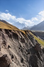 Achik Tash valley between high mountains, mountain landscape with glaciated peak Pik Lenin, Trans