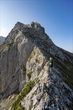 Mountaineer on a narrow ridge, mountain tour to the summit of the Hochkalter, Hochkalter crossing,