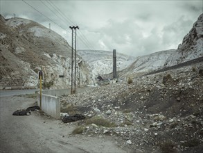 Chimney of the smelter, in the foreground a spoil heap contaminated with heavy metal residues, La