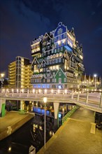 ZAANDAM, NETHERLANDS, MAY 21, 2018: Inntel Hotel in Zaandam illuminated at night. Design of