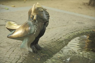 Europabrunnen by Gernot Rumpf 1980, sculpture, mythical creature, owl figure, bird figure, face,