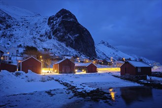 Ramberg village with red traditional rorbue houses in the night. Ramberg, Flakstad, Nordland,