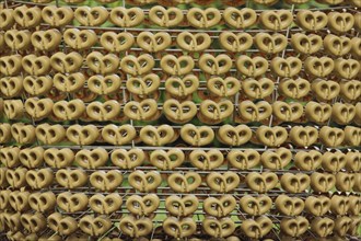 Detail of the sculpture Fruit Cake by Joana Vasconcelos 2011, pattern, row, pretzels, figures,