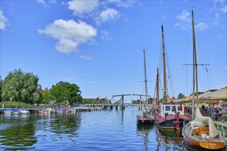 Picturesque view of Greifswald Wieck town harbour with historic wooden bascule bridge over the