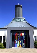 Two-leaf portal designed by Gerhard Böhm and colourful windbreak door made by Peter Luban, St.