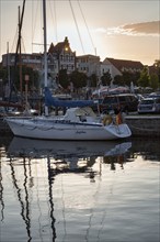 Sailing boats in the old town at sunset, Stralsund harbour, Germany, Europe